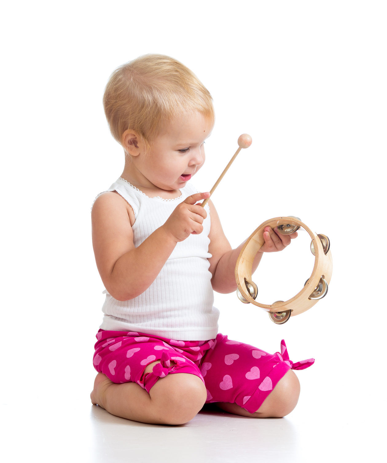 Baby playing with musical toy. Isolated on white background Zajęcia wokalne